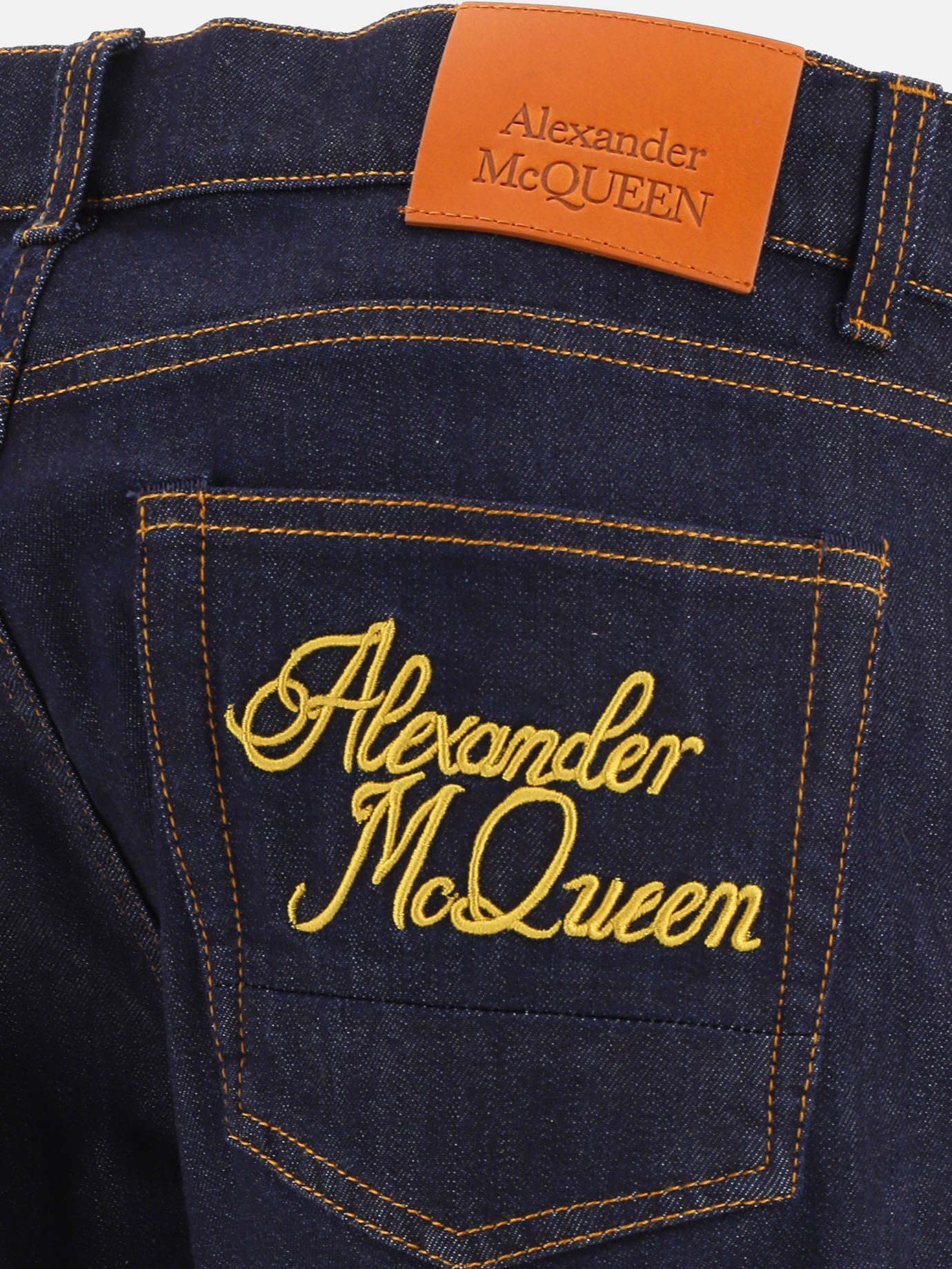 Jeans with embroidery by Alexander McQueen